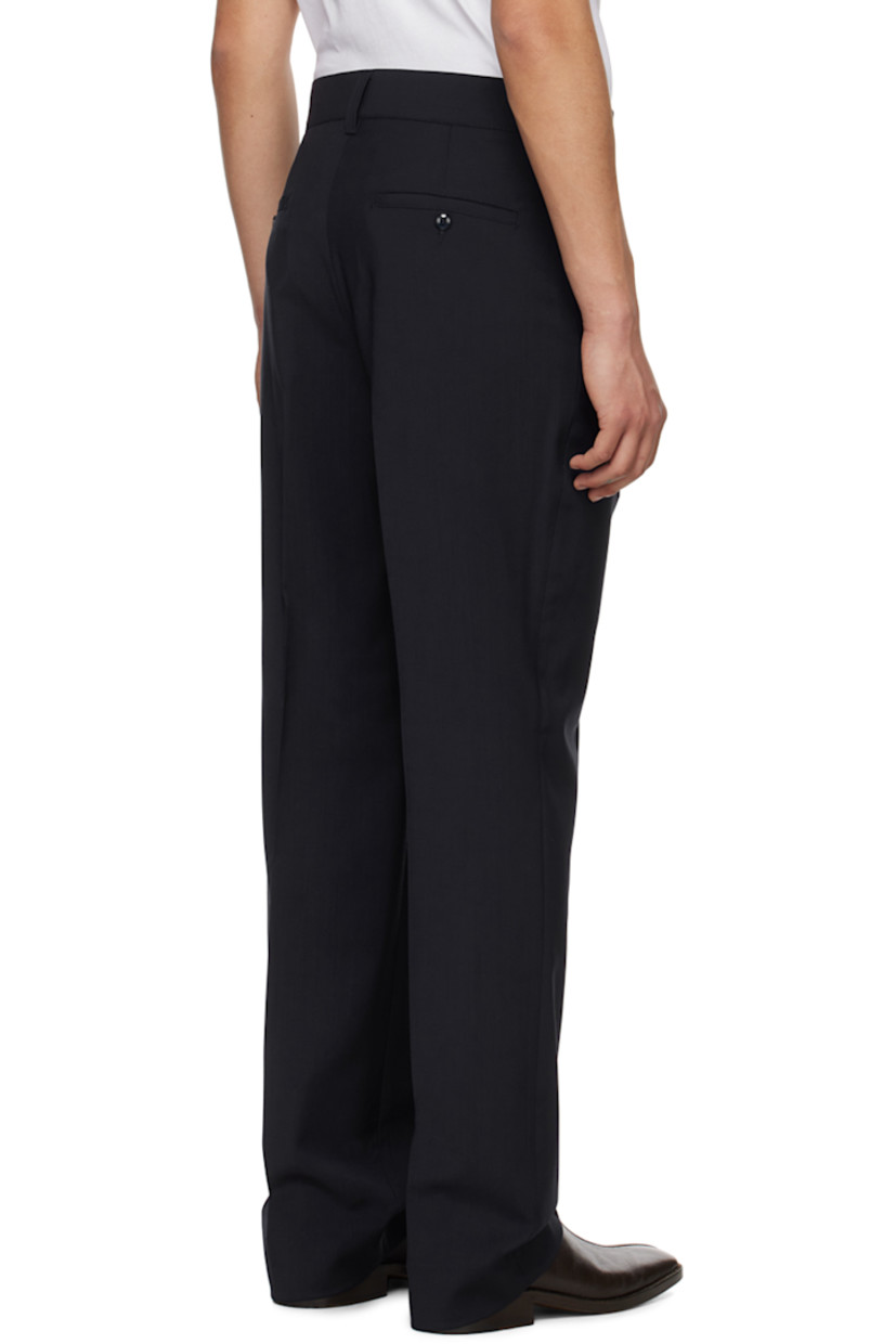 Handcrafted plain-woven tropical virgin wool trousers. 

· Belt loops
· Four-pocket styling
· Zip-fly
· Creased legs

Supplier color: Navy