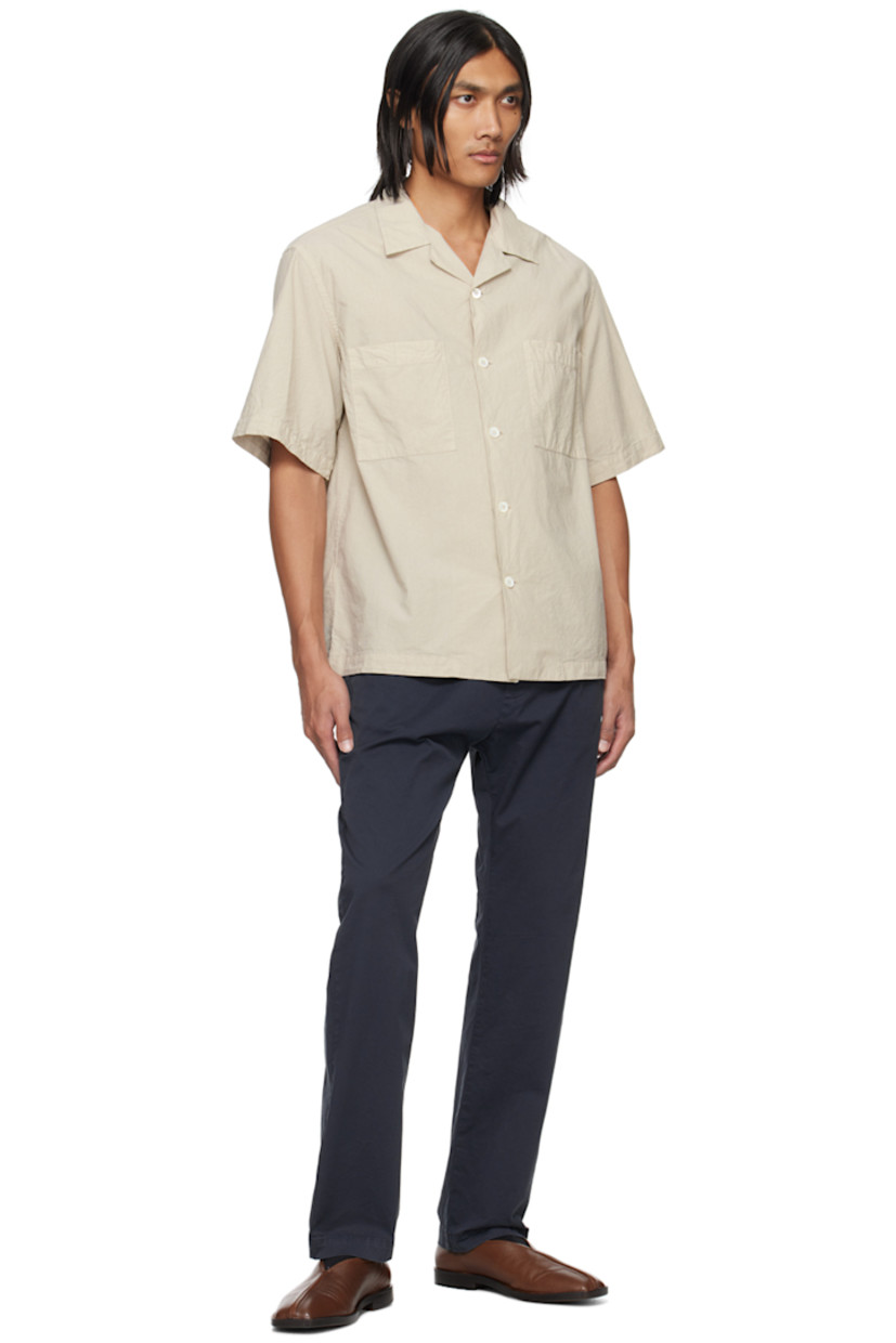 Stretch cotton gabardine trousers.

· Concealed drawstring at elasticized waistband
· Four-pocket styling
· Rolled cuffs

Supplier color: Navy