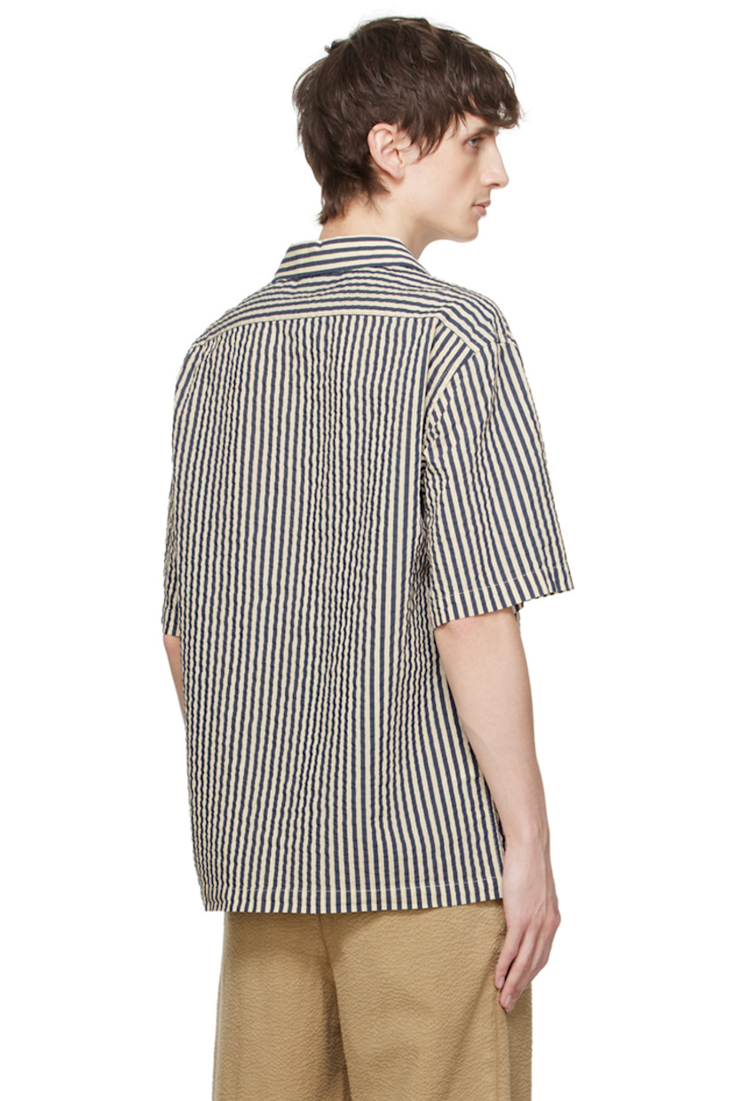 Handcrafted cotton- and silk-blend seersucker shirt. Stripes throughout.

· Open spread collar
· Button closure
· Patch pockets
· Shirttail hem
· Dropped shoulders

Supplier color: White/Navy