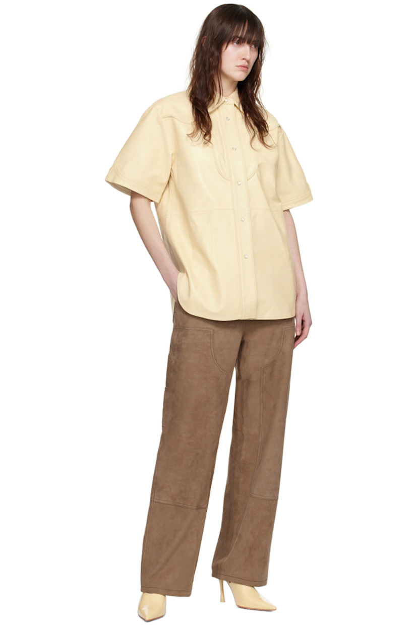 Goatskin suede pants. 

· Paneled construction 
· Belt loops 
· Four-pocket styling 
· Zip-fly
· Patch pocket at outseams 
· Partial stretch satin lining

Supplier color: Sandstone beige