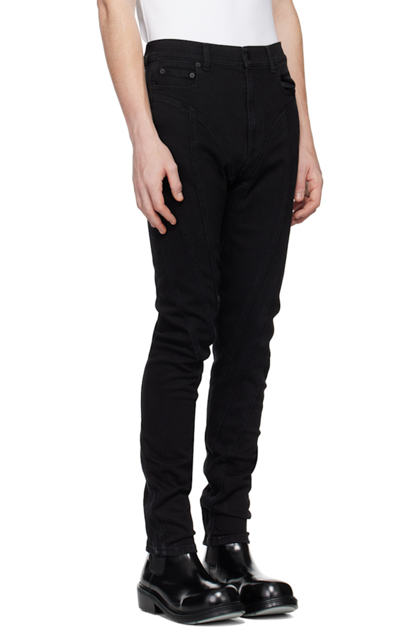 Slim-fit stretch denim jeans.  

· Paneled construction
· Belt loops
· Five-pocket styling
· Zip-fly
· Leather logo patch at back waistband
· Contrast stitching in tan

Supplier color: Black