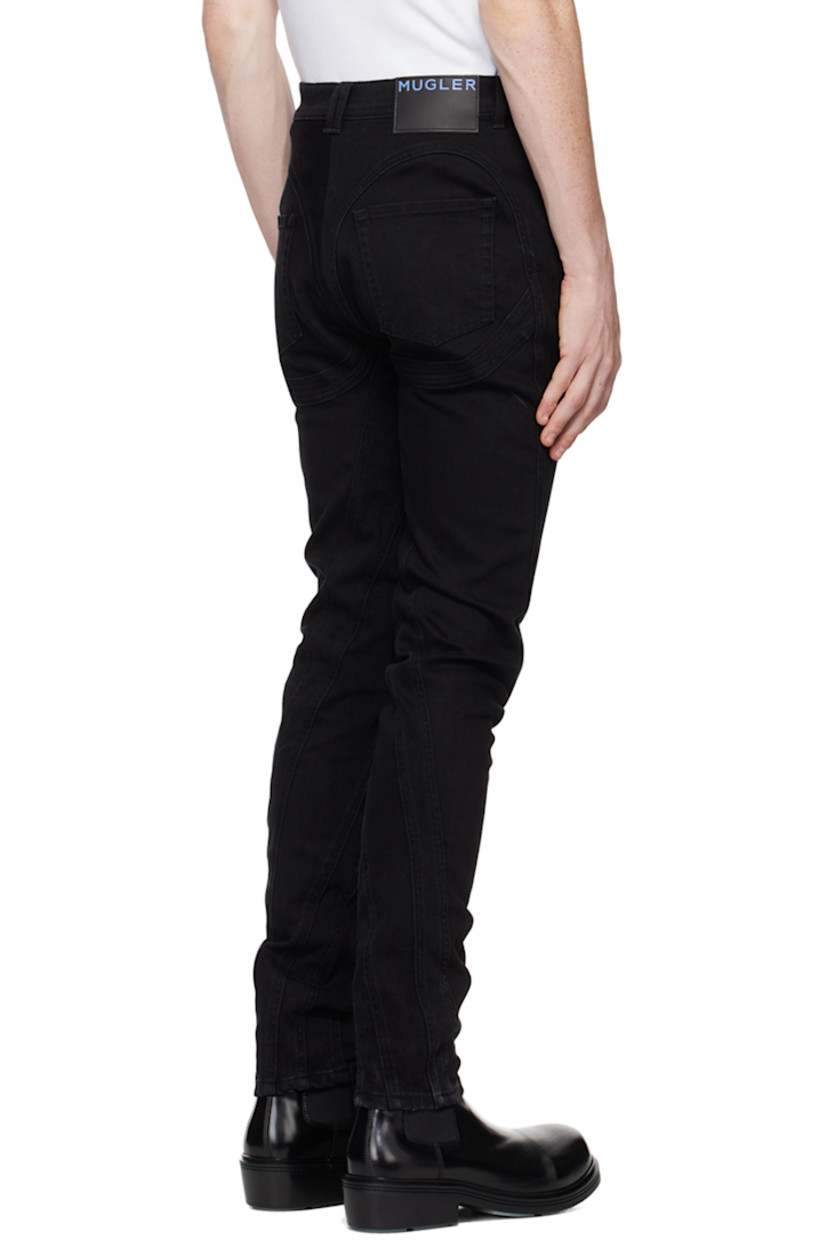 Slim-fit stretch denim jeans.  

· Paneled construction
· Belt loops
· Five-pocket styling
· Zip-fly
· Leather logo patch at back waistband
· Contrast stitching in tan

Supplier color: Black