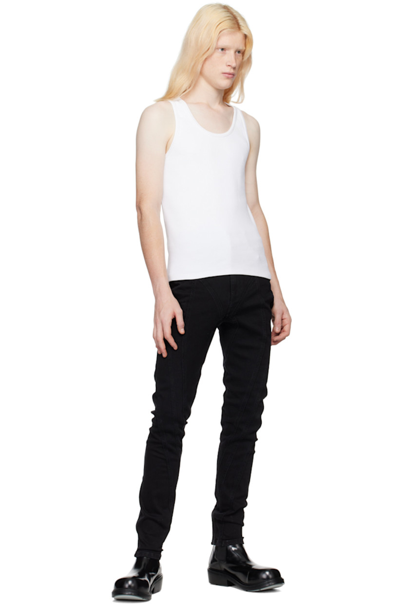 Slim-fit stretch denim jeans.  

· Paneled construction
· Belt loops
· Five-pocket styling
· Zip-fly
· Leather logo patch at back waistband
· Contrast stitching in tan

Supplier color: Black