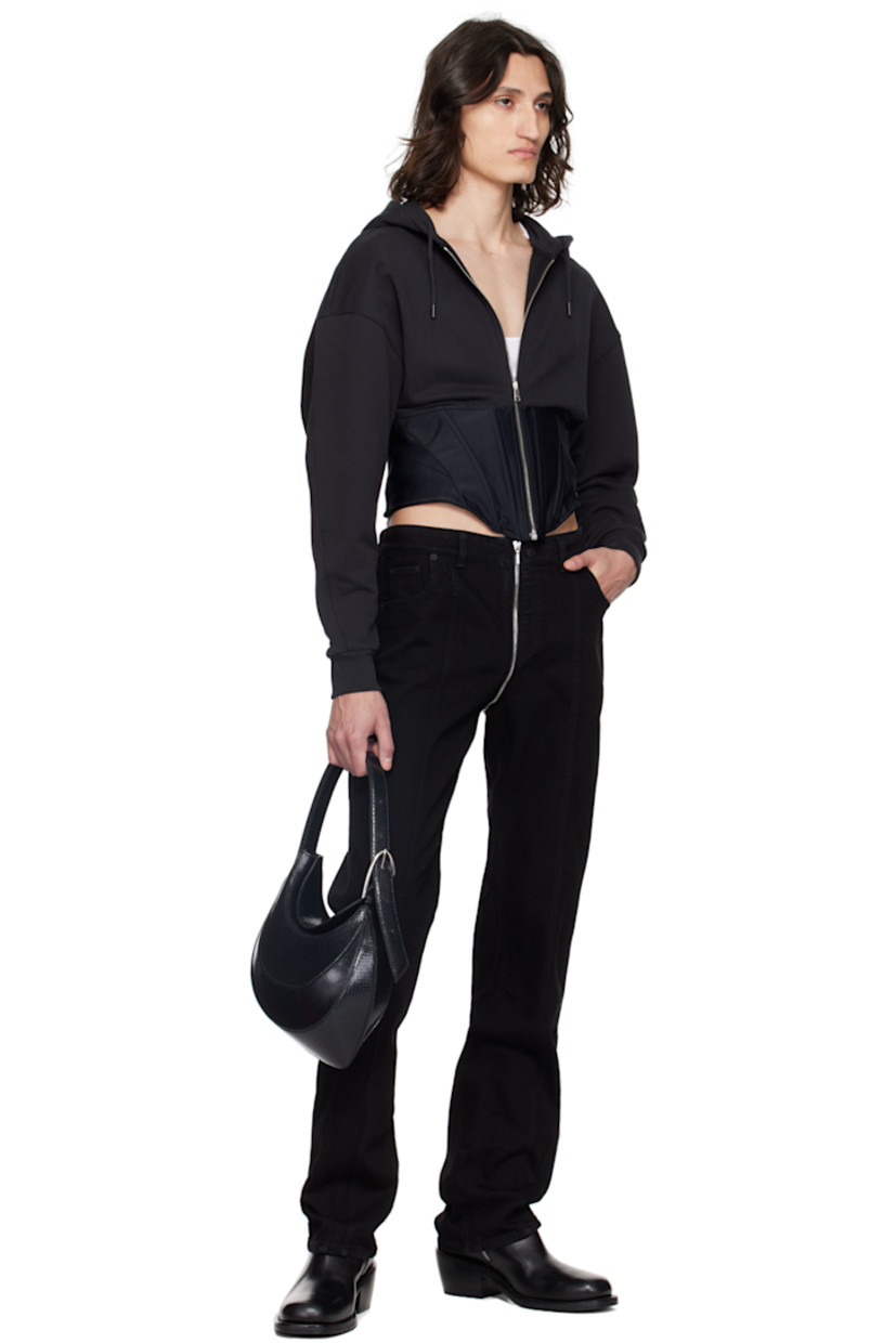 Stretch denim jeans.

· Belt loops
· Five-pocket styling
· Two-way zip-fly extends to back waistband
· Central seam at legs
· Twisted outseams
· Logo patch at back waistband

Supplier color: Black