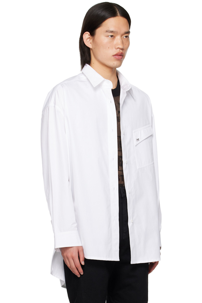 Cotton poplin shirt.

· Spread collar
· Button closure
· Logo hardware at flap pocket
· Droptail hem
· Dropped shoulders
· Single-button barrel cuffs

Supplier color: Blanc optique