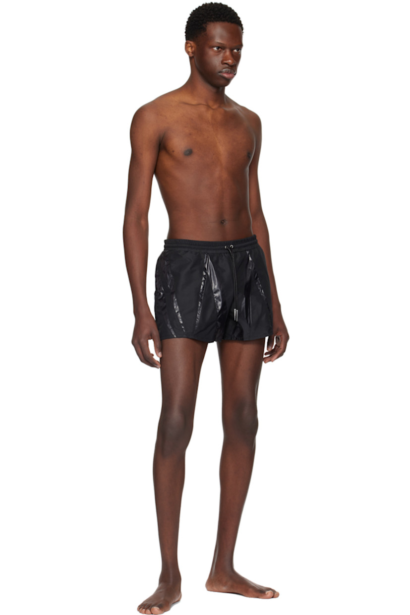 Stretch recycled nylon taffeta swim shorts. Nylon lamé trim throughout.

· Paneled construction
· Drawstring at elasticized waistband
· Two-pocket styling 
· Briefs-style stretch nylon mesh underlay
· Logo-engraved silver-tone hardware

Supplier color: Black