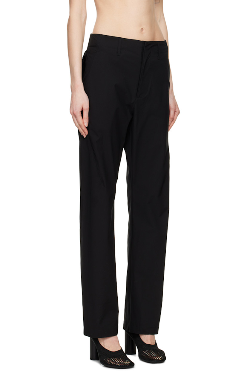 Flared water-resistant plain-woven polyester and stretch nylon trousers. 

· Belt loops at partially-elasticized waistband
· Two-pocket styling
· Zip-fly
· YKK CONCEAL® zip pockets at front
· Detachable zip pouch at back
· Patch pocket with COBRAX closure at interior

Part of the 6.0 collection.

Supplier color: Black