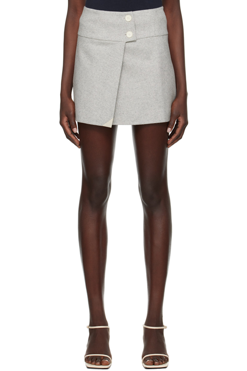 Wool-blend herringbone skirt.

· Wrap construction
· Button closure
· Vent at front hem
·� Full viscose satin lining

Supplier color: Heather grey melange
