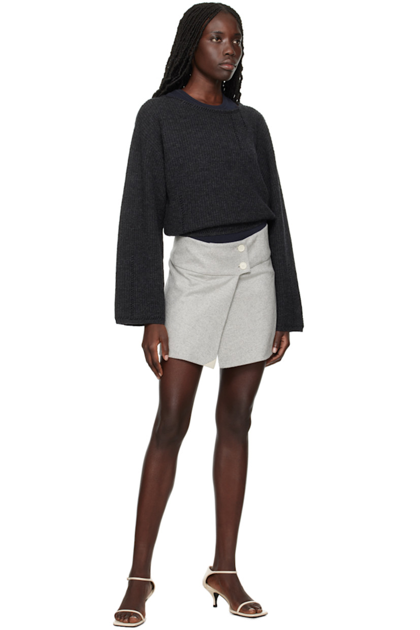 Wool-blend herringbone skirt.

· Wrap construction
· Button closure
· Vent at front hem
· Full viscose satin lining

Supplier color: Heather grey melange