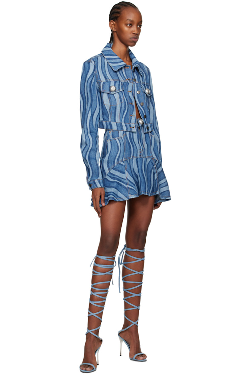 Non-stretch denim skirt. Stripes throughout. 

· Paneled construction
· Belt loops
· Three-pocket styling
· Zip-fly
· Ruffles at flared hem
· Logo-engraved brass-tone hardware
· Contrast stitching in tan

Supplier color: Indigo multi