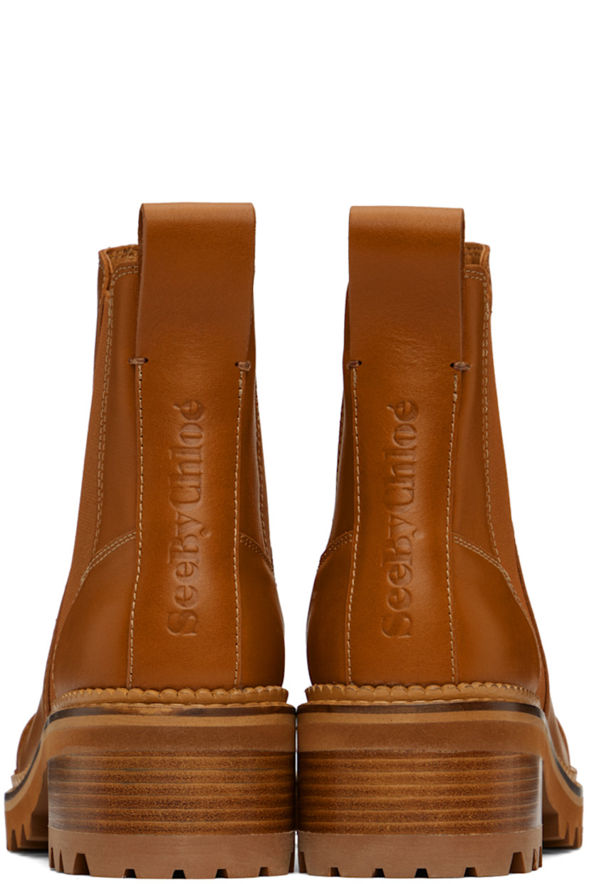 Ankle-high paneled buffed calfskin Chelsea boots in tan.

· Elasticized gussets at sides
· Pull-loop at heel tab
· Logo embossed at heel counter
· Buffed calfskin lining in beige
· Scalloped edge detailing at welt 
· Topstitching at welt in beige 
· Foam rubber midsole
· Stacked leather block heel
· Lug rubber sole
· Heel: H2"

Supplier color: Tan