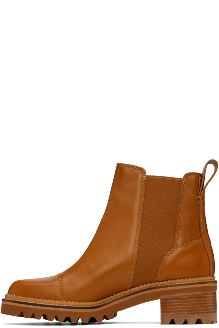 Ankle-high paneled buffed calfskin Chelsea boots in tan.

· Elasticized gussets at sides
· Pull-loop at heel tab
· Logo embossed at heel counter
· Buffed calfskin lining in beige
· Scalloped edge detailing at welt 
· Topstitching at welt in beige 
· Foam rubber midsole
· Stacked leather block heel
· Lug rubber sole
· Heel: H2"

Supplier color: Tan