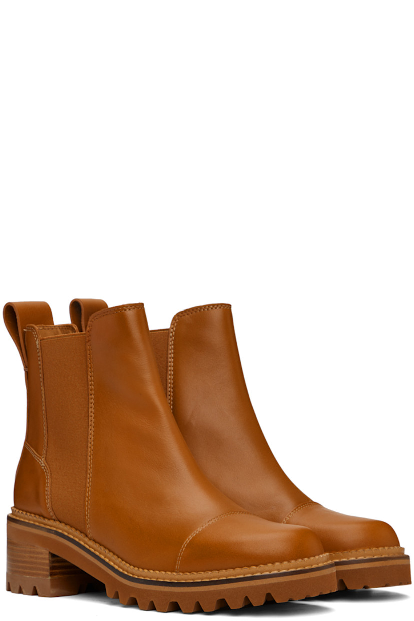 Ankle-high paneled buffed calfskin Chelsea boots in tan.

· Elasticized gussets at sides
· Pull-loop at heel tab
· Logo embossed at heel counter
· Buffed calfskin lining in beige
· Scalloped edge detailing at welt 
· Topstitching at welt in beige 
· Foam rubber midsole
· Stacked leather block heel
· Lug rubber sole
· Heel: H2"

Supplier color: Tan