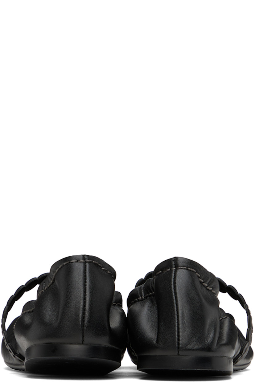 Grained nappa lambskin ballerina flats in black.

· Partially elasticized strap at vamp
· Elasticized trim at collar
· Logo embossed at padded leather footbed
· Grained leather lining
· Treaded rubber sole
· Contrast stitching in gray

Supplier color: Black