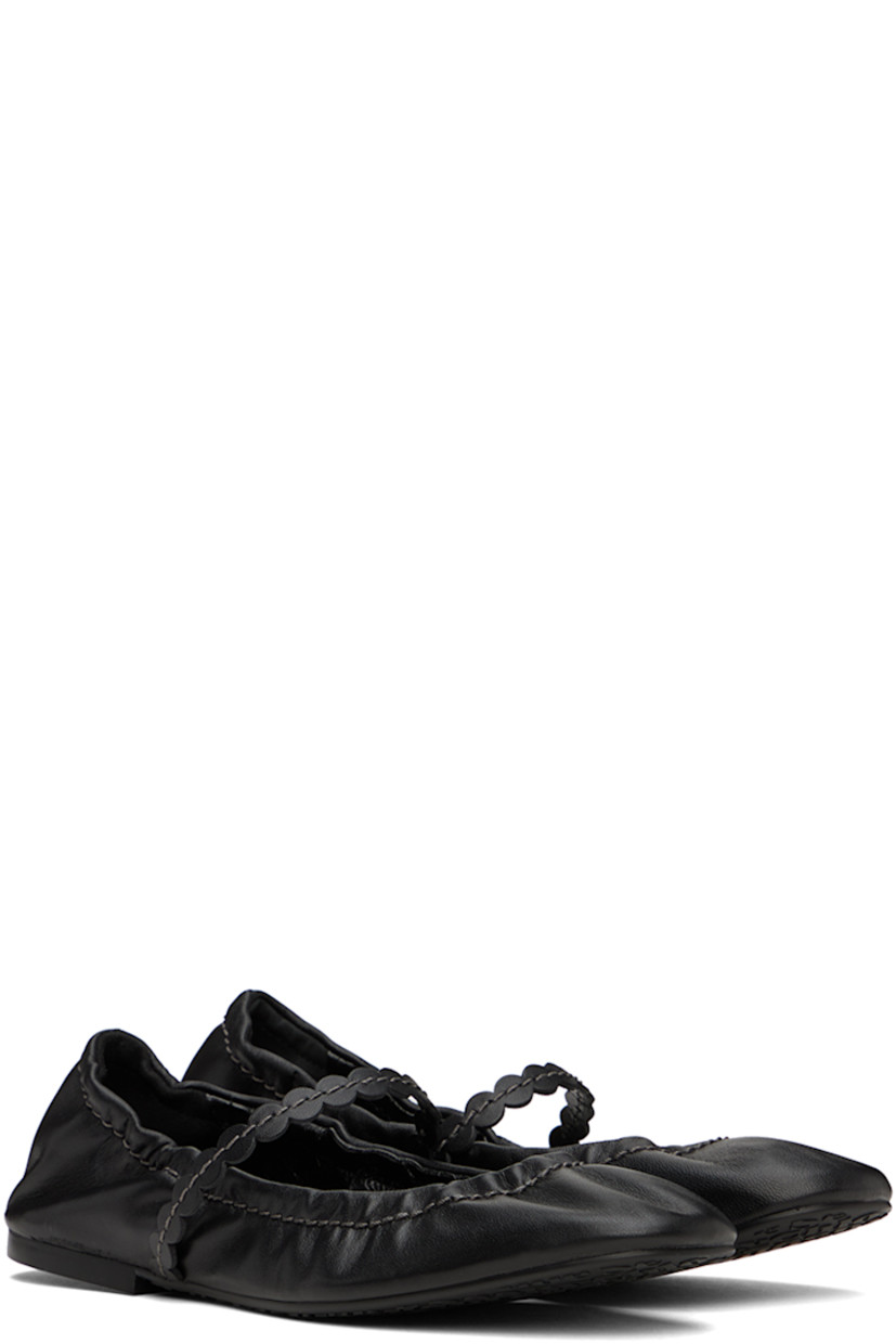 Grained nappa lambskin ballerina flats in black.

· Partially elasticized strap at vamp
· Elasticized trim at collar
· Logo embossed at padded leather footbed
· Grained leather lining
· Treaded rubber sole
· Contrast stitching in gray

Supplier color: Black