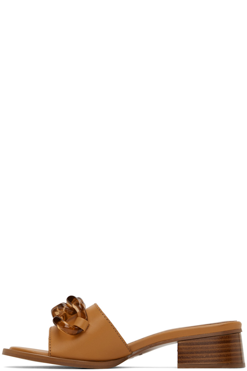 Buffed calfskin slip-on heeled sandals in tan.

· Open toe
· Plexiglass curb chain at vamp
· Logo embossed at padded calfskin footbed
· Stacked leather block heel with rubber injection
· Leather sole with rubber injection
· Logo-engraved gold-tone hardware
· Heel: H1.5"

Supplier color: Tan