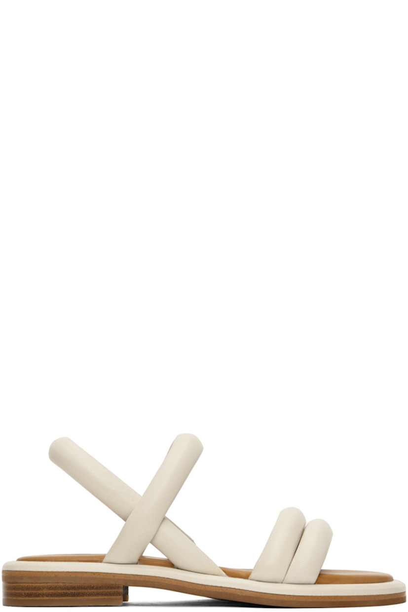 Grained lambskin flat sandals in off-white.

· Open toe
· Padded straps at vamp
· Partially elasticized slingback strap
· Logo embossed at padded leather footbed
· Leather block heel with rubber injection
· Rubber sole

Supplier color: Natural