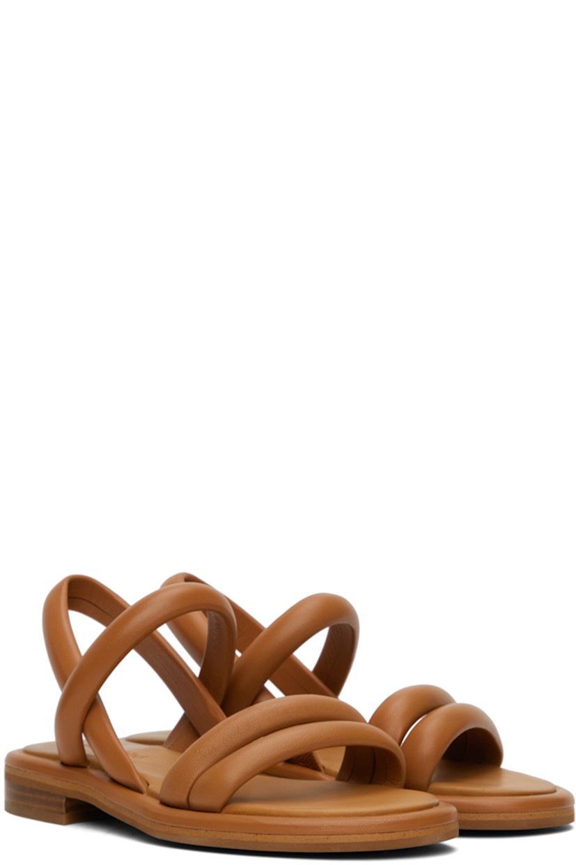 Grained lambskin flat sandals in tan.

· Open toe
· Padded straps at vamp
· Partially elasticized slingback strap
· Logo embossed at padded leather footbed
· Leather block heel with rubber injection
· Rubber sole

Supplier color: Tan