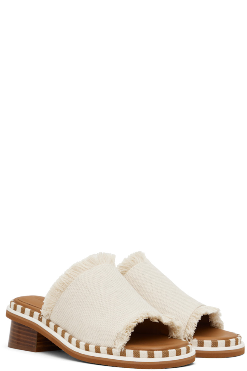 Fringed canvas slip-on heeled sandals in off-white. 

· Open toe
· Logo embossed at molded calfskin footbed
· Striped canvas trim at welt
· Stacked leather heel with rubber injection
· Crepe rubber sole

Supplier color: Natural