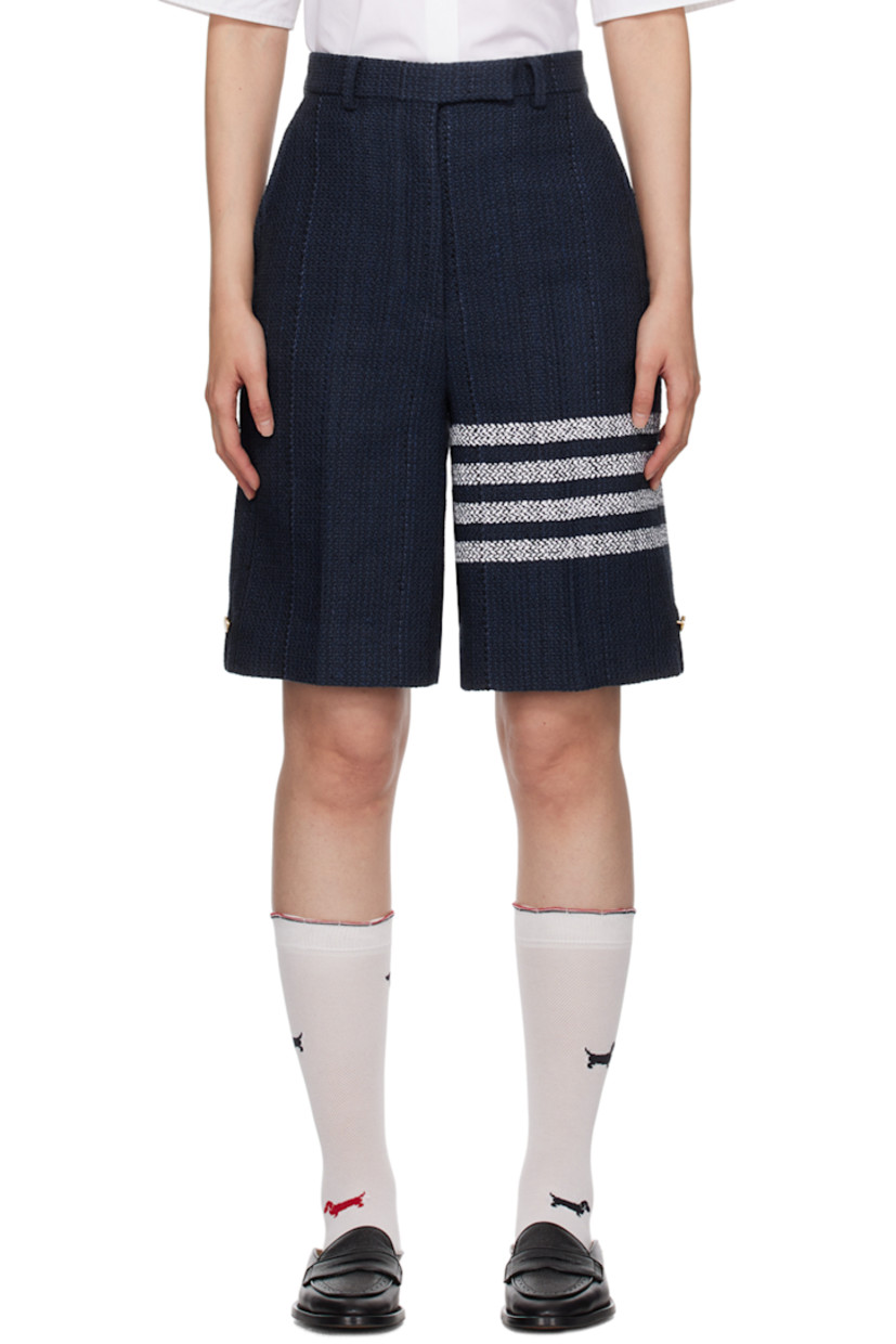 Polyester- and acrylic-blend tweed shorts.

· High-rise
· Belt loops
· Four-pocket styling
· Zip-fly
· Jacquard stripes at leg
· Tricolor grosgrain flag at back waistband
· Full striped silk chiffon lining
· Logo-engraved gold-tone hardware

Supplier color: Navy