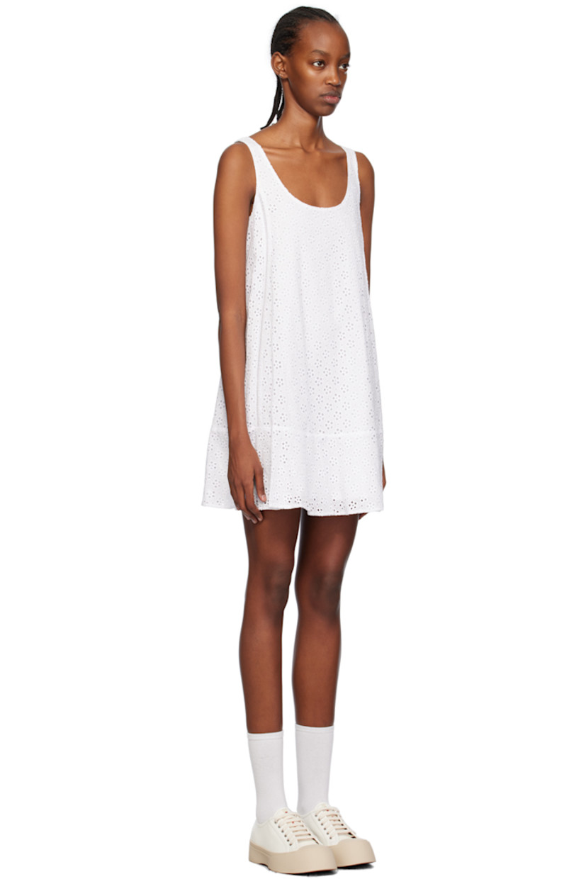 Cotton-blend broderie anglaise dress.

· Scoop neck
· Ruffled trim at hem 
· Fixed shoulder straps
· Logo patch at back collar 
· Full cotton poplin lining

Supplier color: Off white