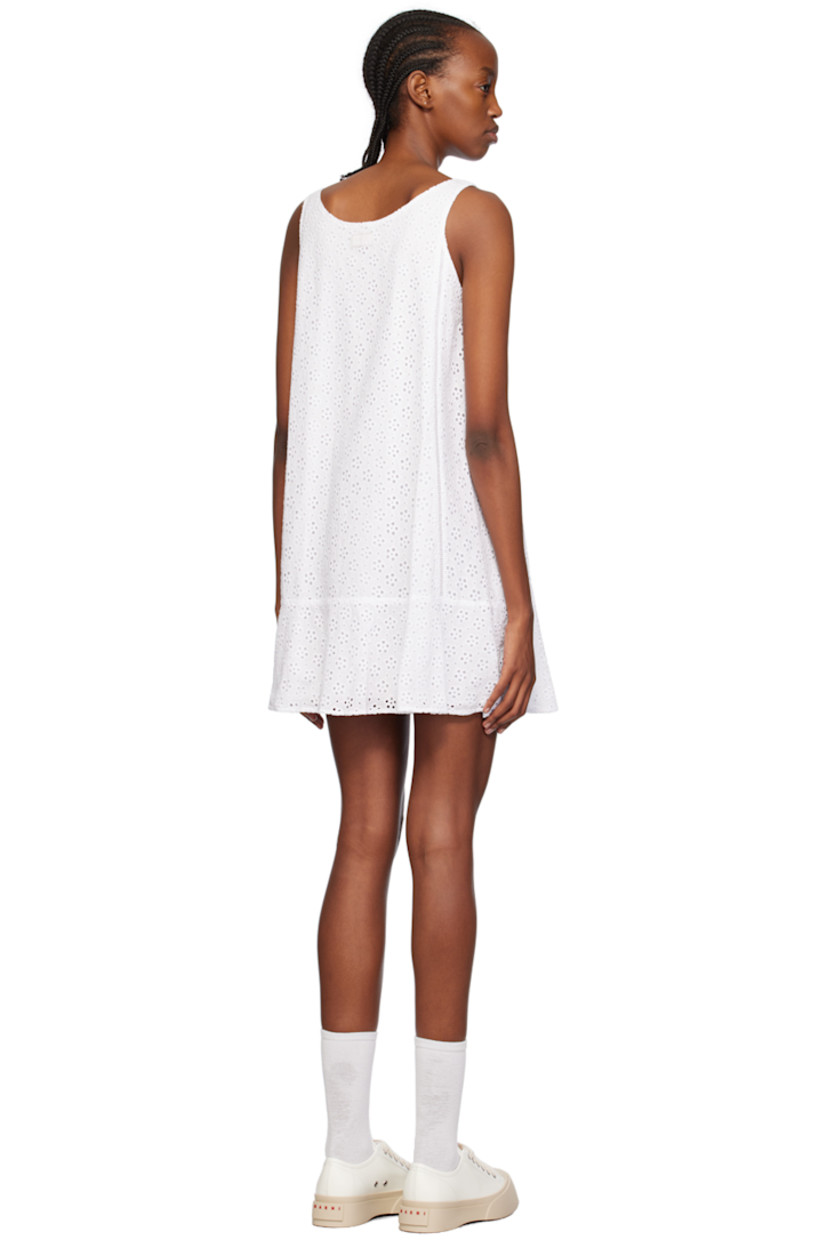 Cotton-blend broderie anglaise dress.

· Scoop neck
· Ruffled trim at hem 
· Fixed shoulder straps
· Logo patch at back collar 
· Full cotton poplin lining

Supplier color: Off white
