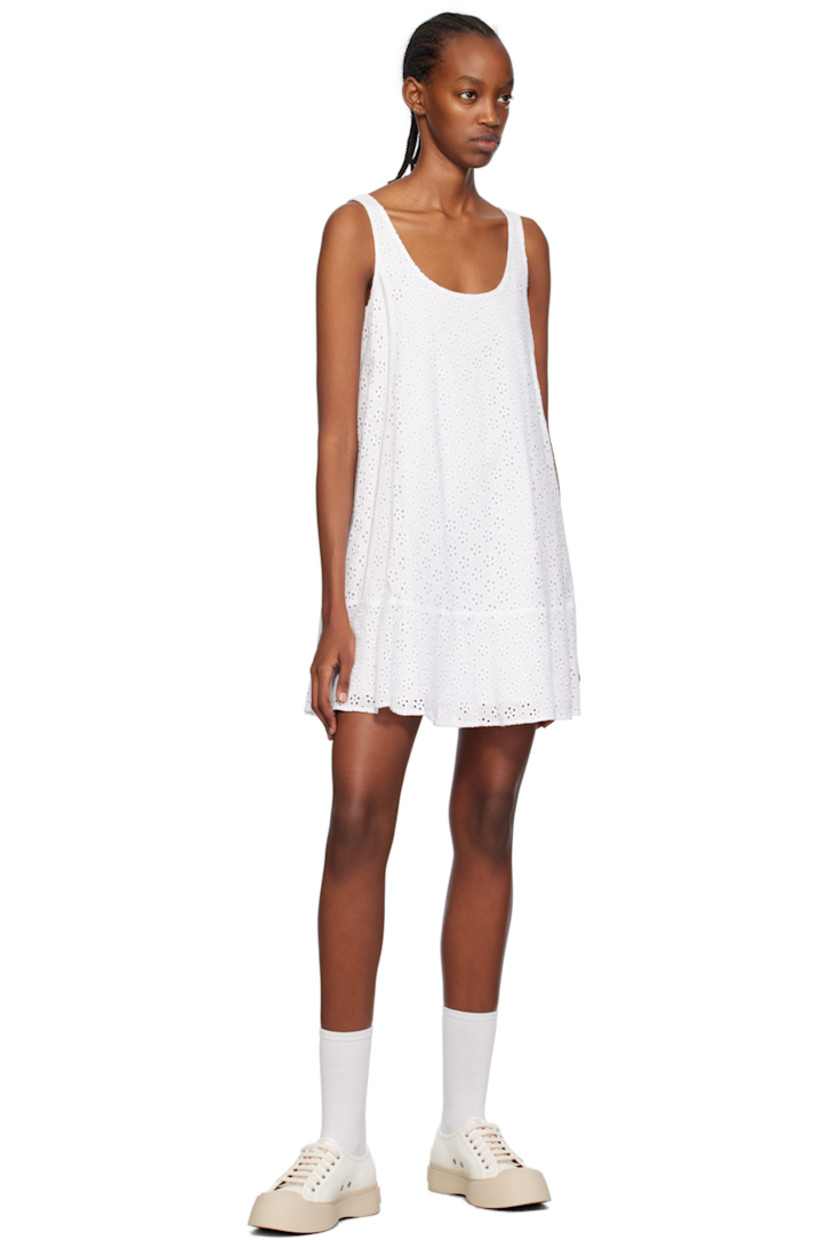 Cotton-blend broderie anglaise dress.

· Scoop neck
· Ruffled trim at hem 
· Fixed shoulder straps
· Logo patch at back collar 
· Full cotton poplin lining

Supplier color: Off white