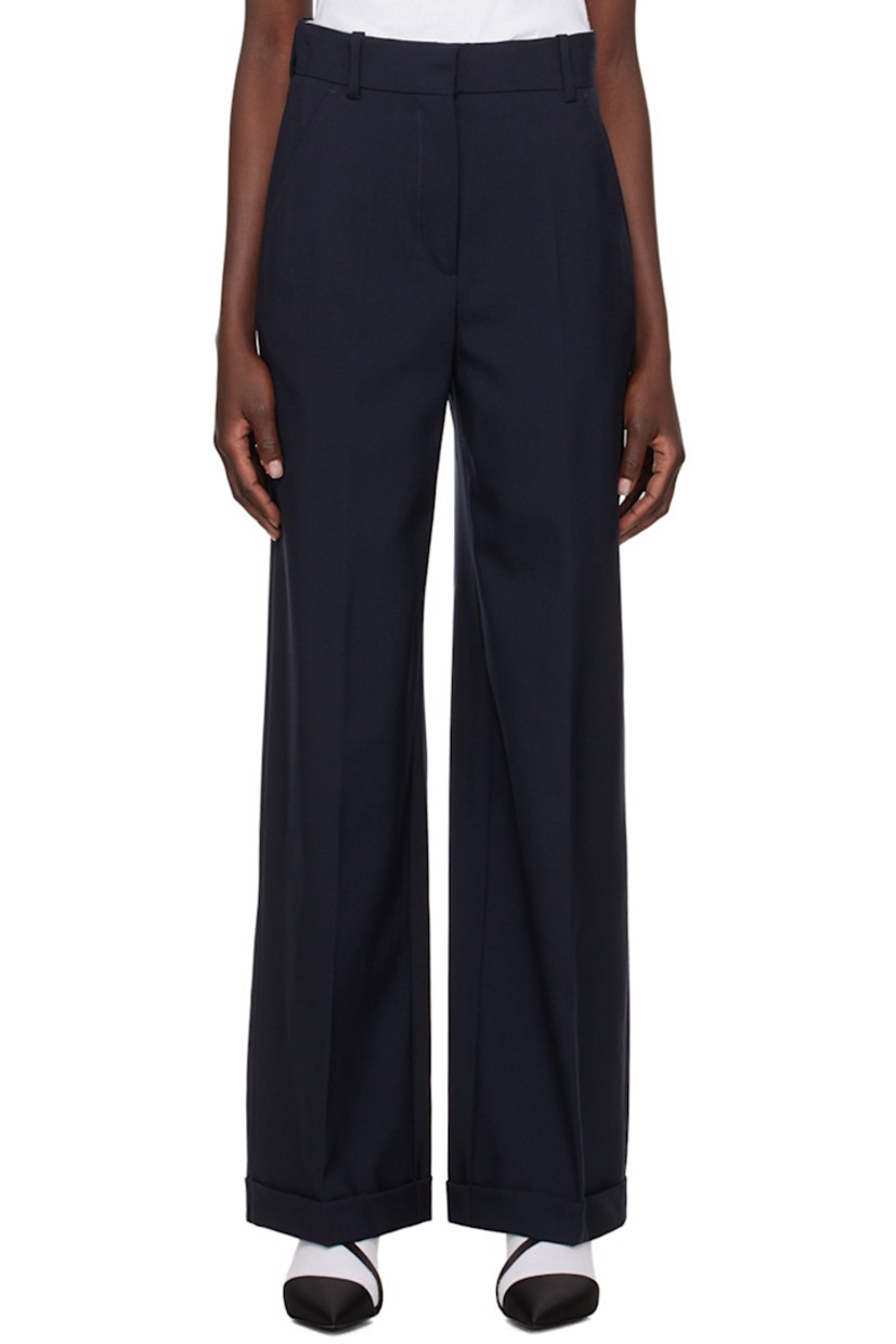 Virgin wool trousers.

· Belt loops 
· Four-pocket styling 
· Zip-fly 
· Creased legs 
· Logo patch at back 

Supplier color: Midnight blue