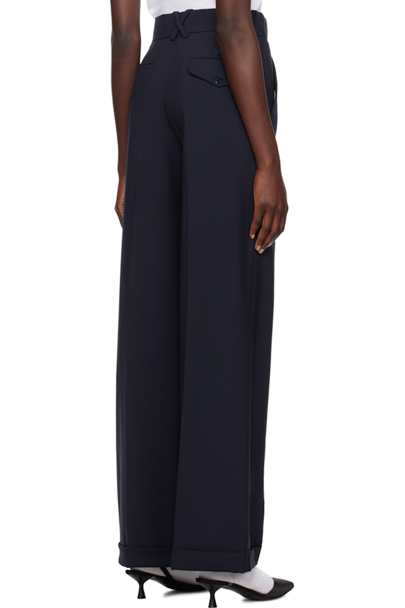 Virgin wool trousers.

· Belt loops 
· Four-pocket styling 
· Zip-fly 
· Creased legs 
· Logo patch at back 

Supplier color: Midnight blue