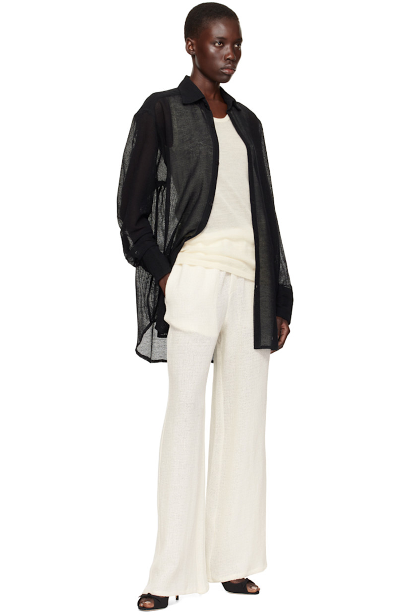 Linen- and rayon-blend tweed trousers.

· Elasticized waistband
· Two-pocket styling
· Mock-fly

Supplier color: Sand beige