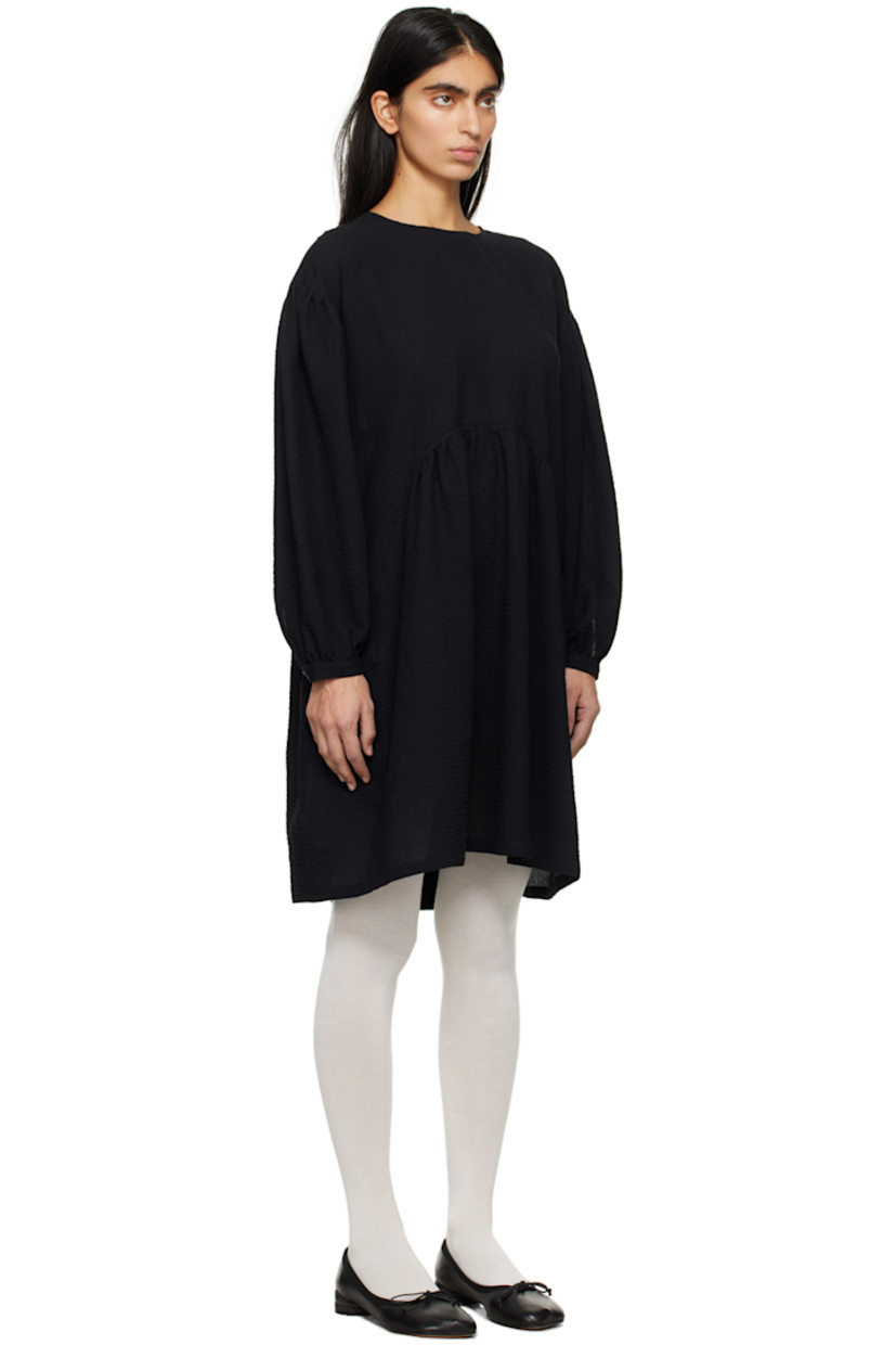 Stretch cotton cloqué dress.

· Crewneck
· Gathering at waist
· Seam pockets 
· Dropped shoulders
· Balloon sleeves 
· Single-button barrel cuffs
· Button fastening and keyhole at back collar
· Corozo hardware

Supplier color: Black