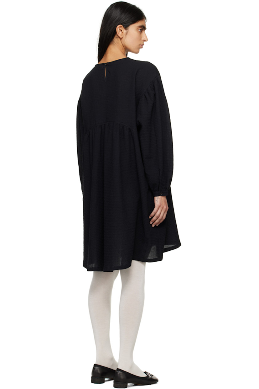 Stretch cotton cloqué dress.

· Crewneck
· Gathering at waist
· Seam pockets 
· Dropped shoulders
· Balloon sleeves 
· Single-button barrel cuffs
· Button fastening and keyhole at back collar
· Corozo hardware

Supplier color: Black