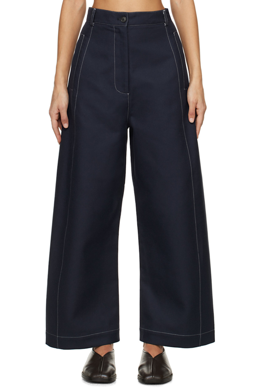 Wide-leg organic cotton twill trousers.

· High-rise
· Belt loops
· Three-pocket styling
· Zip-fly
· Corozo hardware
· Contrast stitching in white

Supplier color: Navy/Off-white