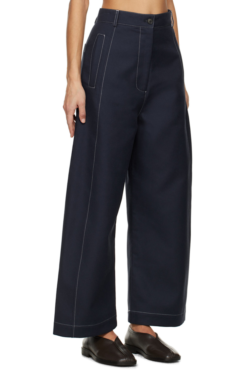 Wide-leg organic cotton twill trousers.

· High-rise
· Belt loops
· Three-pocket styling
· Zip-fly
· Corozo hardware
· Contrast stitching in white

Supplier color: Navy/Off-white