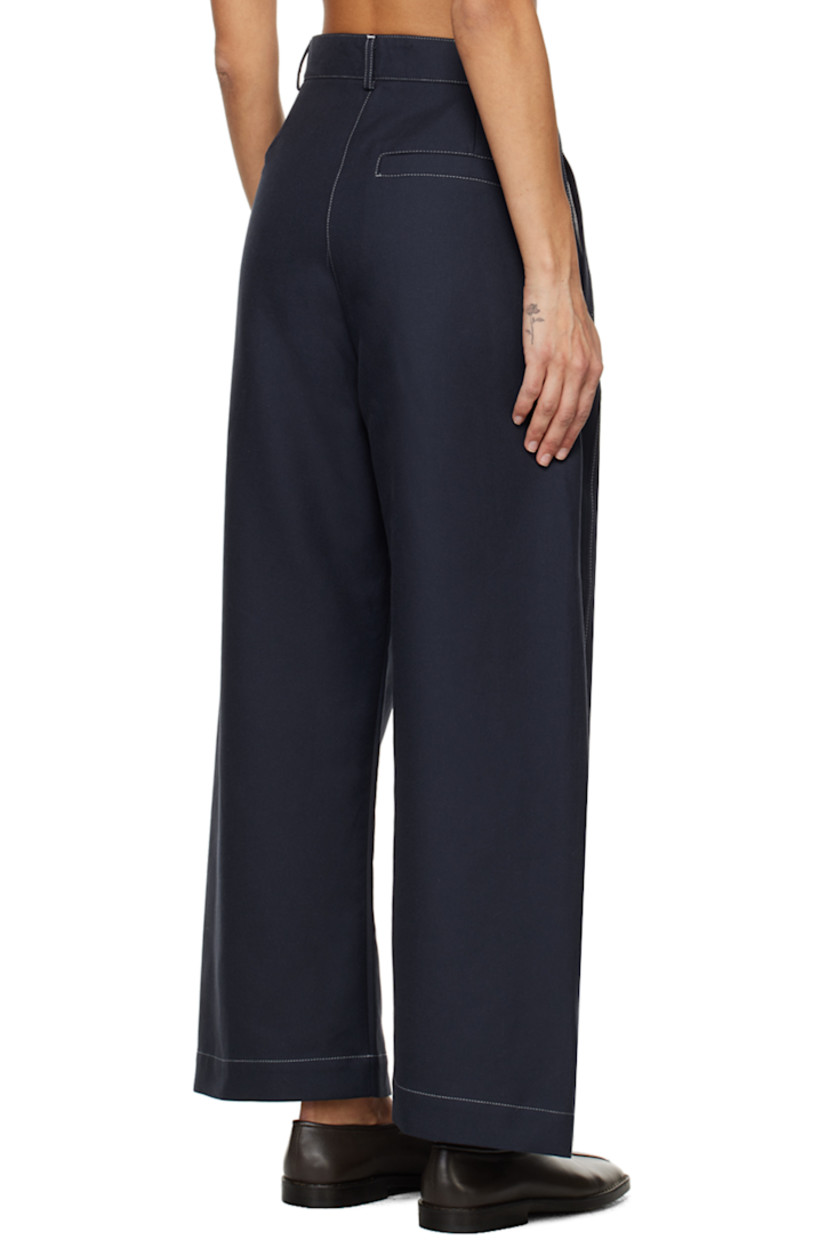 Wide-leg organic cotton twill trousers.

· High-rise
· Belt loops
· Three-pocket styling
· Zip-fly
· Corozo hardware
· Contrast stitching in white

Supplier color: Navy/Off-white