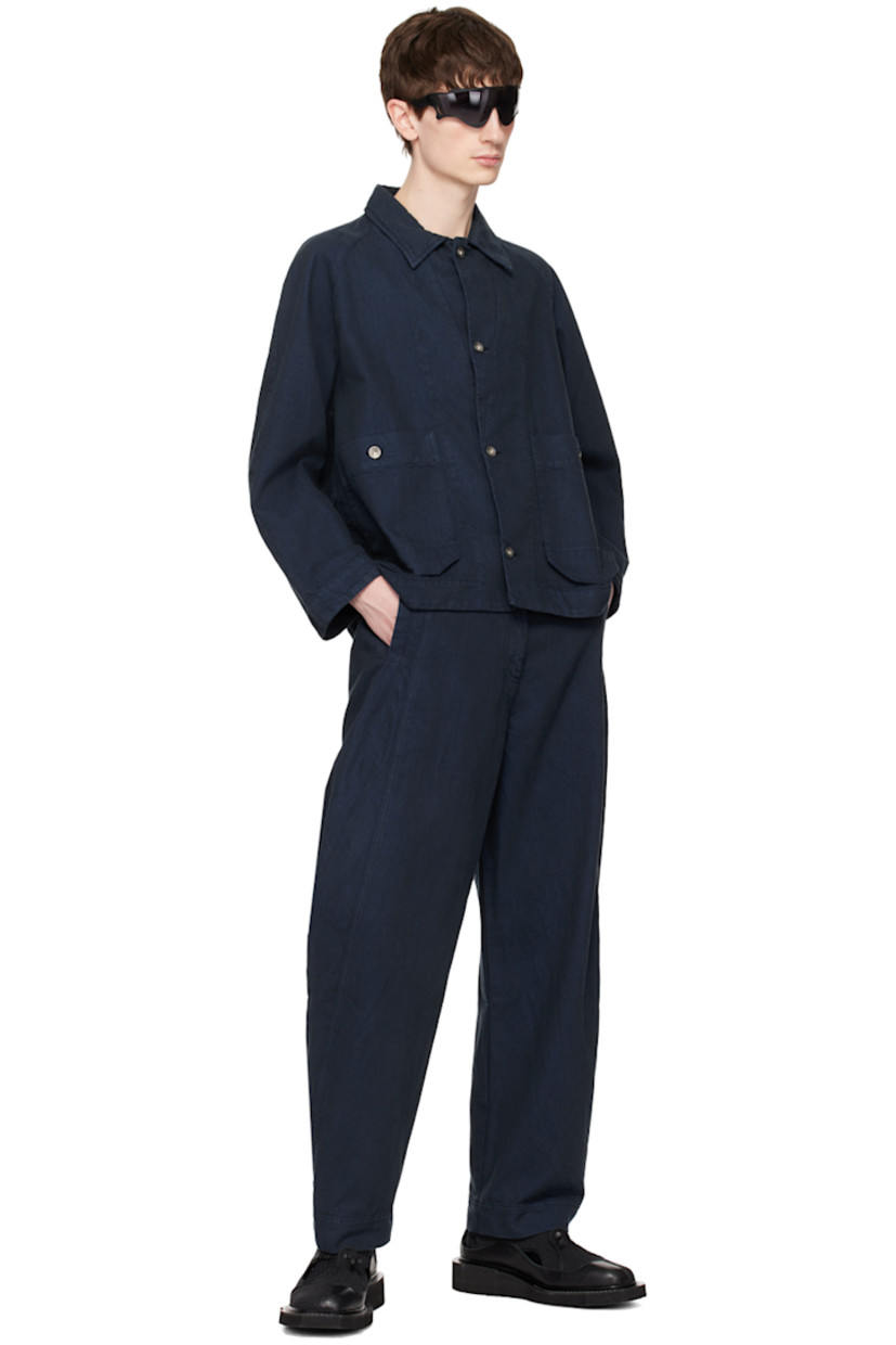 Non-stretch recycled cotton-blend denim jacket.

· Spread collar
· Button closure 
· Patch pockets
· Raglan sleeves
· Storm flap at back 
· Logo-engraved silver-tone hardware

Supplier color: Navy blue twill