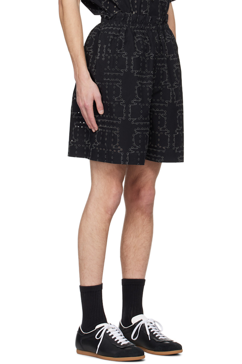 Organic cotton poplin shorts. Graphic pattern embroidered and cutouts throughout. 

· Elasticized waistband 
· Two-pocket styling

Supplier color: Black punched boxes