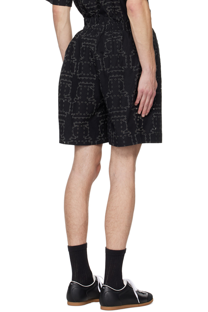 Organic cotton poplin shorts. Graphic pattern embroidered and cutouts throughout. 

· Elasticized waistband 
· Two-pocket styling

Supplier color: Black punched boxes