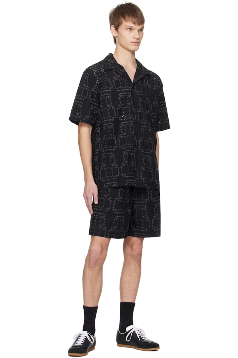 Organic cotton poplin shorts. Graphic pattern embroidered and cutouts throughout. 

· Elasticized waistband 
· Two-pocket styling

Supplier color: Black punched boxes