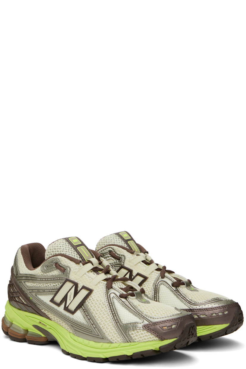 Low-top paneled mesh and buffed faux-leather sneakers in green, brown, and silver-tone. Alternate laces included.

· Lace-up closure
· Padded tongue and collar
· Rubberized logo appliqué at sides
· Logo-embossed rubber trim at heel counter 
· Mesh lining
· ABZORB foam rubber midsole
· Stability Web at treaded N-ergy rubber outsole

Part of the SSENSE XX exclusive offering.

Supplier color: Pistachio/Thirty watt