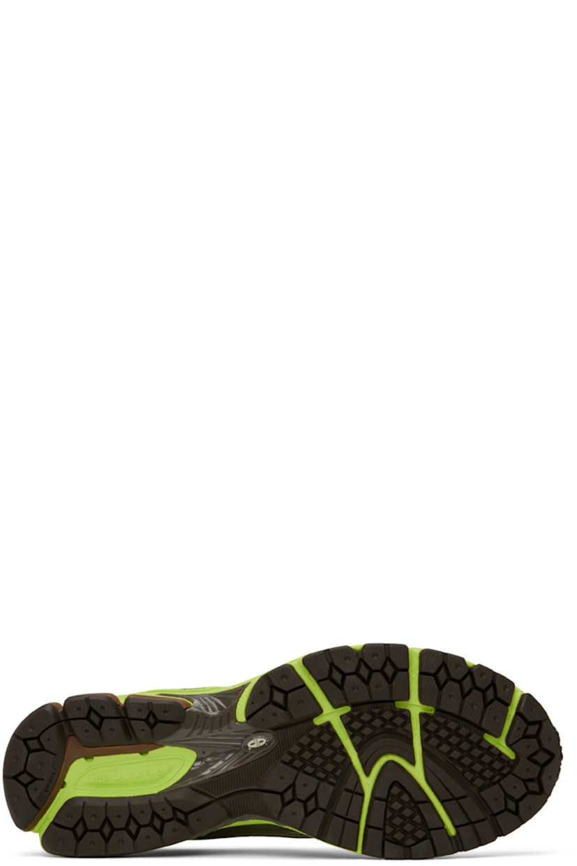 Low-top paneled mesh and buffed faux-leather sneakers in green, brown, and silver-tone. Alternate laces included.

· Lace-up closure
· Padded tongue and collar
· Rubberized logo appliqué at sides
· Logo-embossed rubber trim at heel counter 
· Mesh lining
· ABZORB foam rubber midsole
· Stability Web at treaded N-ergy rubber outsole

Part of the SSENSE XX exclusive offering.

Supplier color: Pistachio/Thirty watt