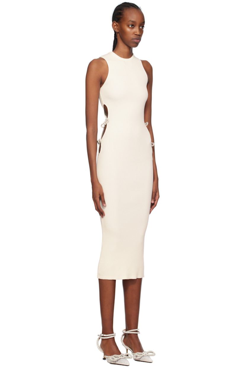 Rib knit viscose- and polyester-blend dress.

· Crewneck
· Cutouts and crystal-cut bow appliqués at side seams
· Unlined

Supplier color: Ivory