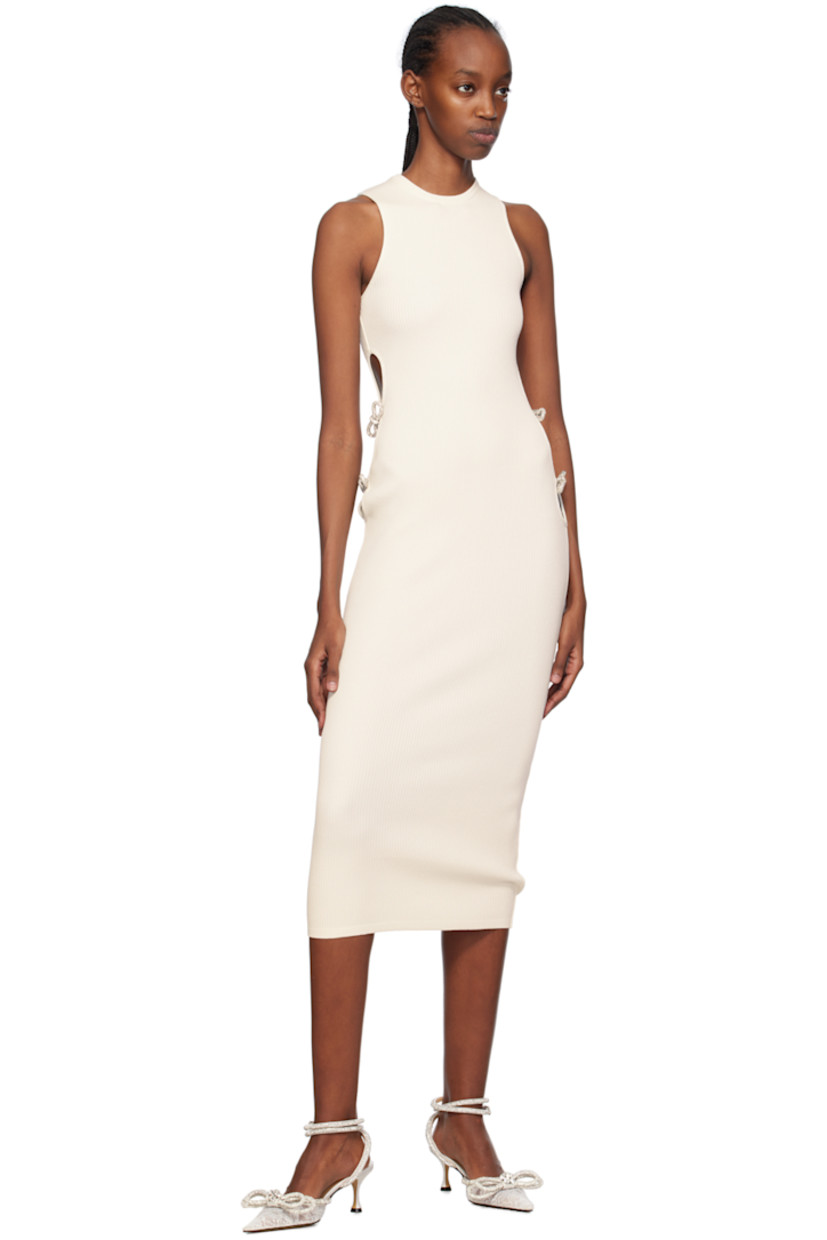 Rib knit viscose- and polyester-blend dress.

· Crewneck
· Cutouts and crystal-cut bow appliqués at side seams
· Unlined

Supplier color: Ivory