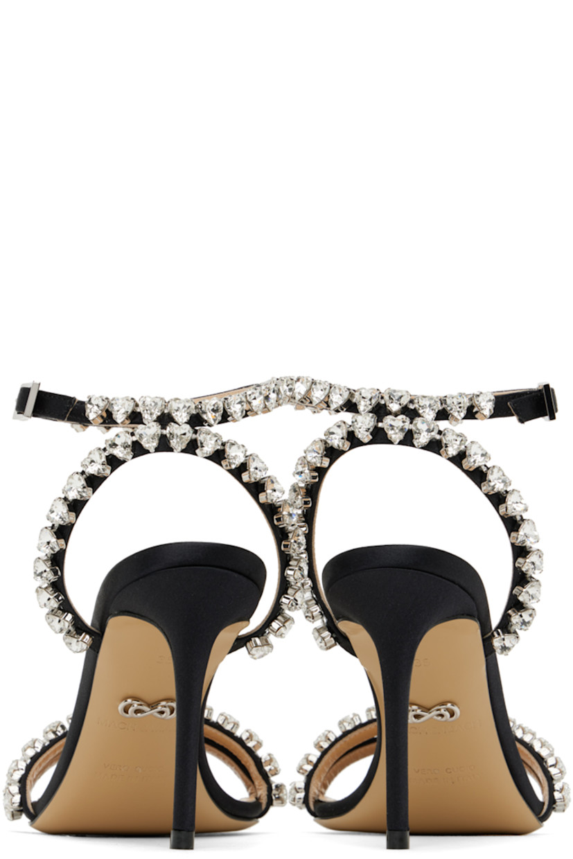 Satin heeled sandals in black.

· Crystal-cut detailing throughout
· Pin-buckle ankle strap 
· Logo stamp at padded leather footbed
· Covered stiletto heel with rubber injection
· Leather sole
· Heel: H3.5"

Supplier color: Black