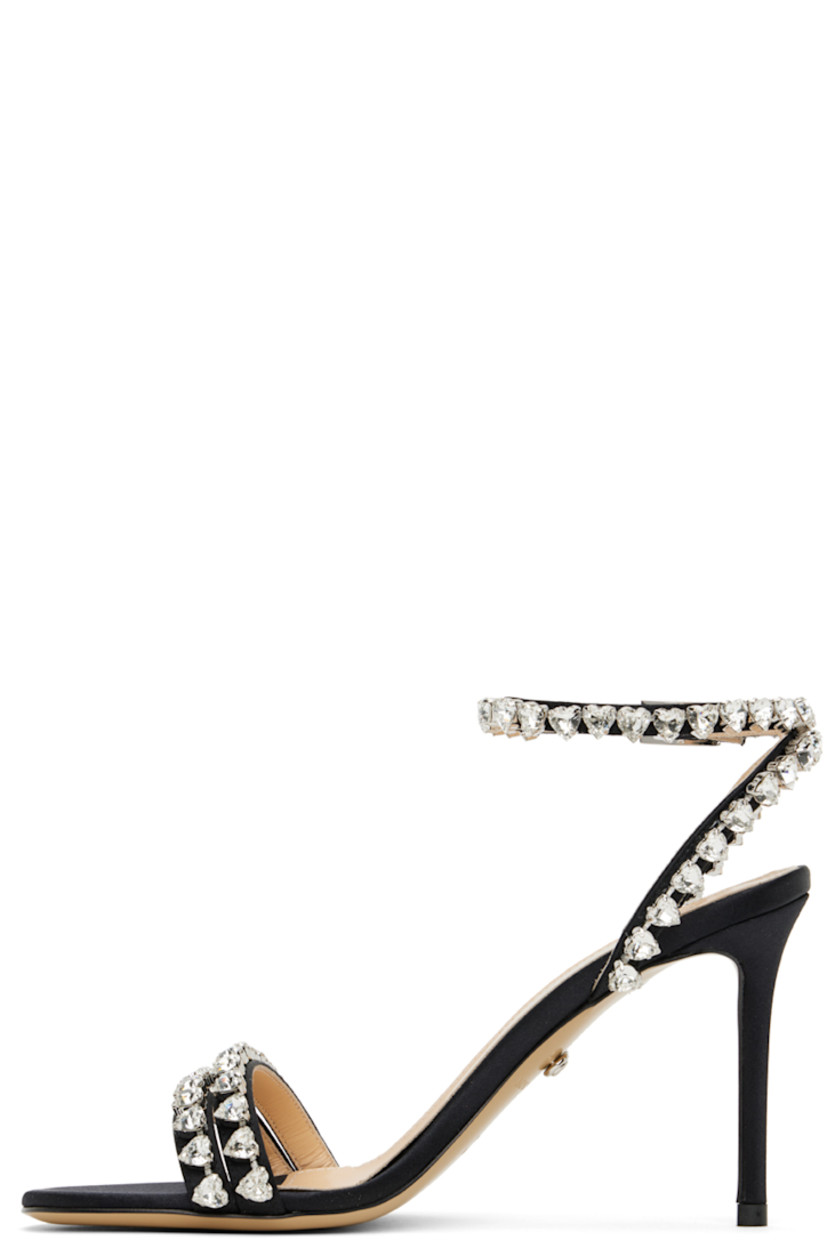 Satin heeled sandals in black.

· Crystal-cut detailing throughout
· Pin-buckle ankle strap 
· Logo stamp at padded leather footbed
· Covered stiletto heel with rubber injection
· Leather sole
· Heel: H3.5"

Supplier color: Black