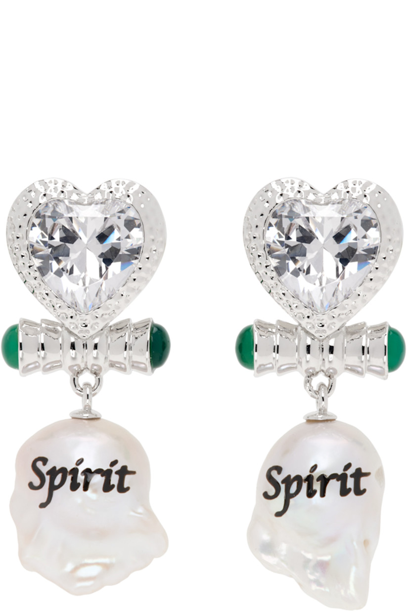 Pair of drop earrings in rhodium-plated brass.

· Graphic with bezel-set cubic zirconia at face
· Green jadeite at sides
· Baroque freshwater pearl with printed text
· Post-stud fastening
· H1.5" x W0.75"

Supplier color: White