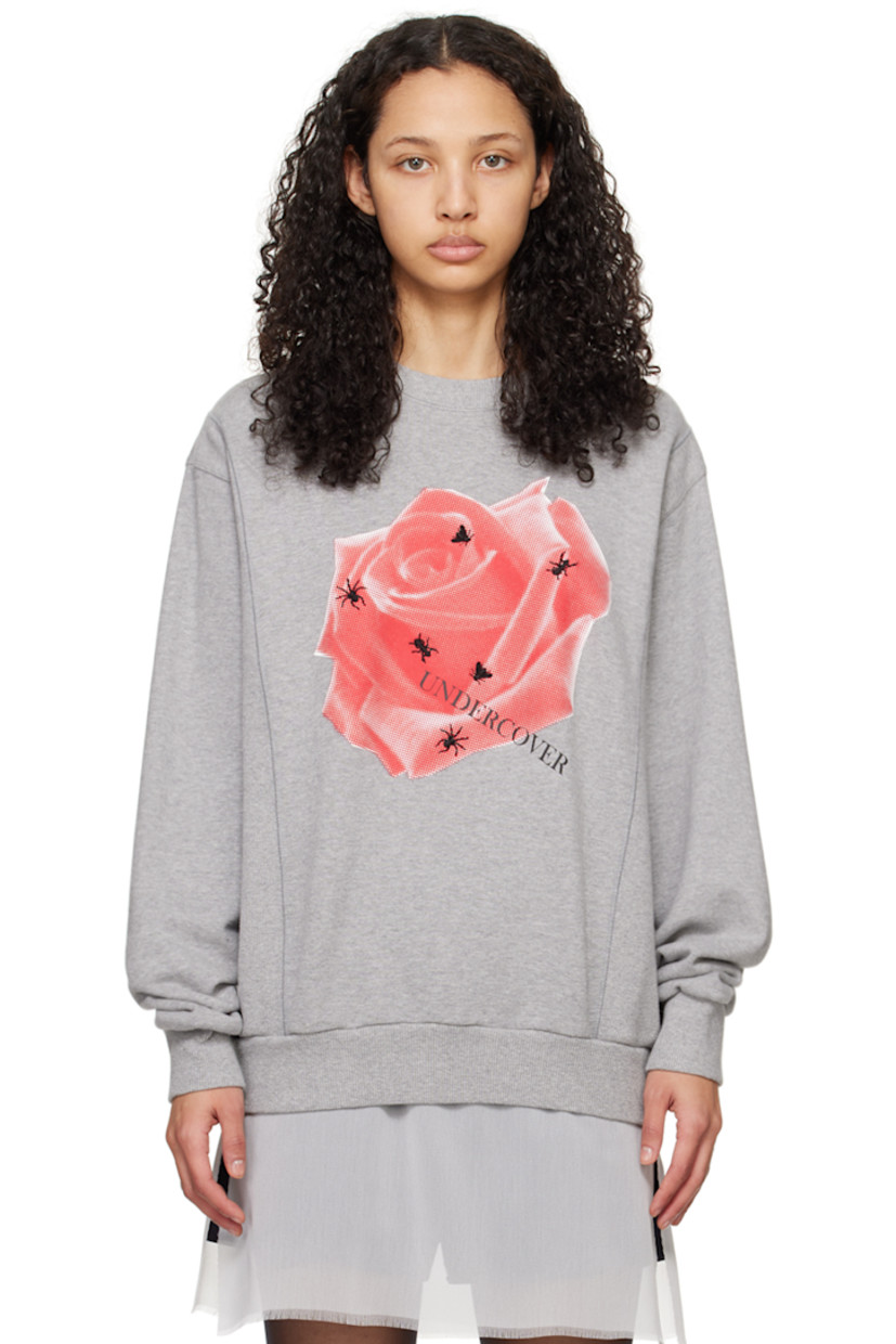 French terry and rib knit sweatshirt. 

· Paneled construction
· Rib knit crewneck, hem, and cuffs
· Floral graphic and logo printed at front 
· Graphic embroidered at front 

Supplier color: Top gray