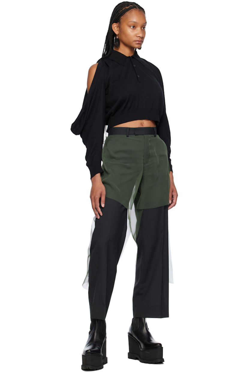 Knit cotton- and nylon-blend polo.

· Rib knit spread collar, hem, and cuffs
· Three-button placket
· Ruching at shoulders
· Cutout and draping at sleeves

Supplier color: Black