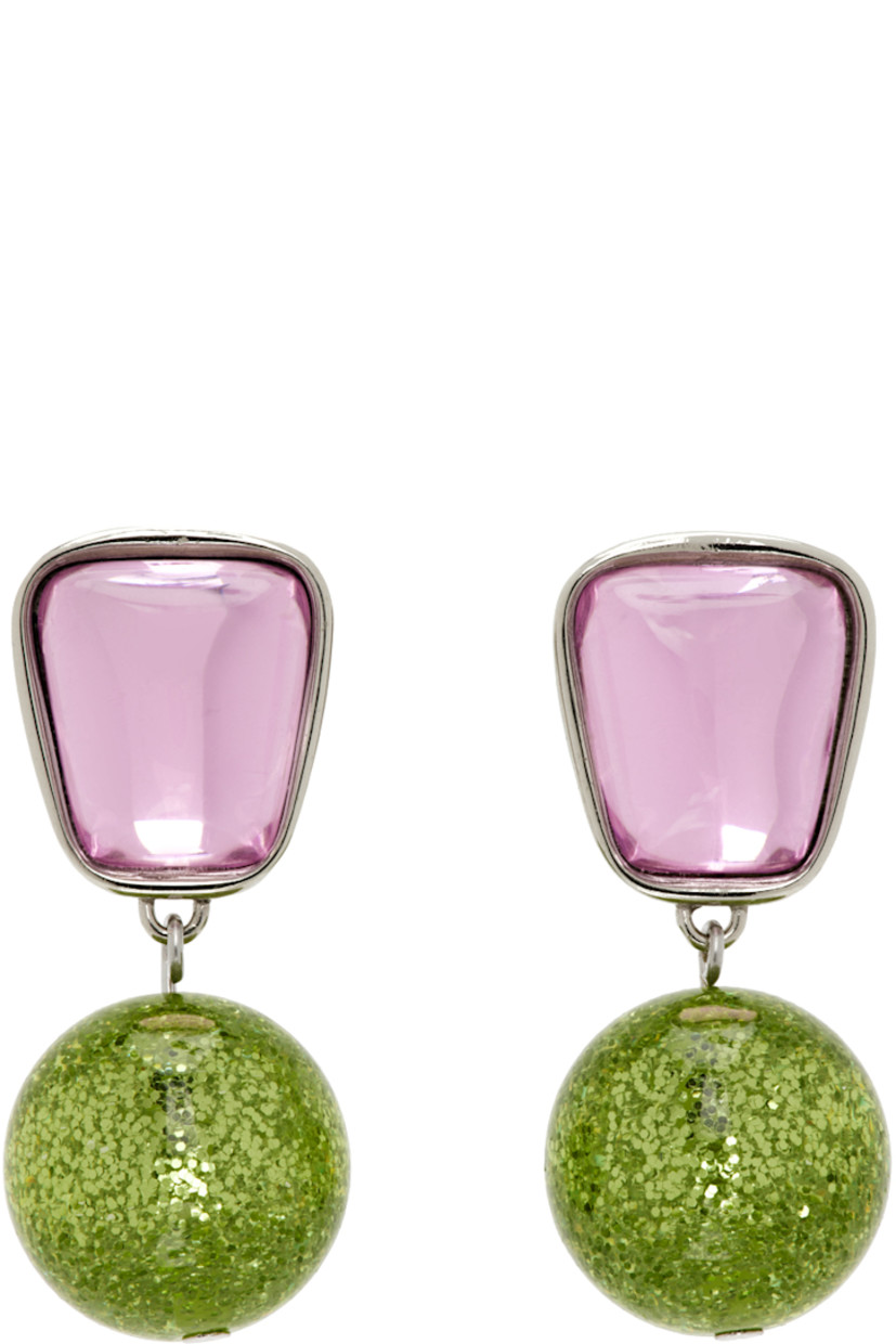 Pair of drop earrings in white bronze.

· Pink glass crystal at face
· Glittered green crystal-cut accent at drop
· Sterling silver post-stud fastening
· H1.5" x W0.75"

Supplier color: Kiss
