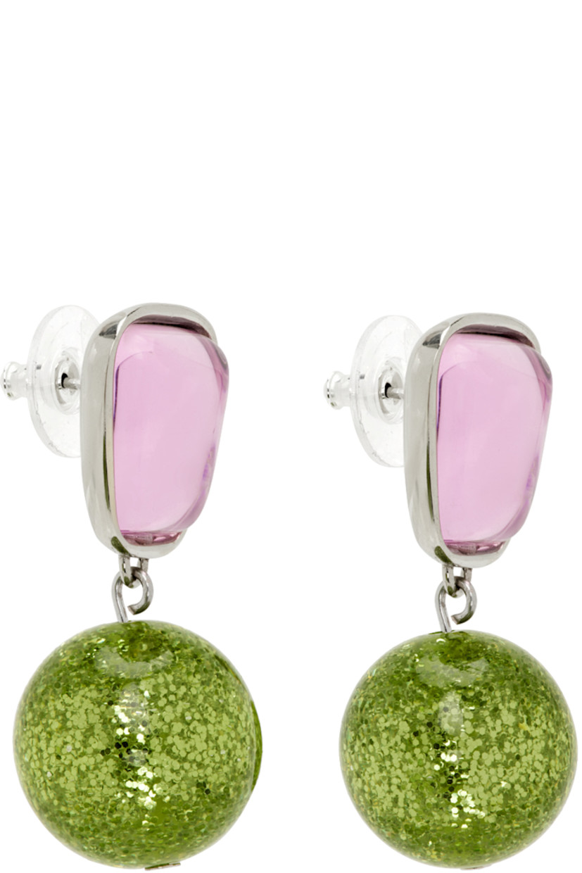 Pair of drop earrings in white bronze.

· Pink glass crystal at face
· Glittered green crystal-cut accent at drop
· Sterling silver post-stud fastening
· H1.5" x W0.75"

Supplier color: Kiss